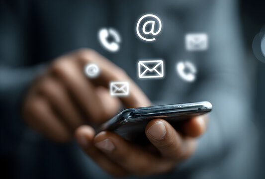 person holding smartphone with floating contact communication icons including phone, speech bubble, email and mail app symbols in white color against blurred background showcasing multi-channel connec