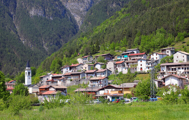 Small Village called Slizza di Resia in Northern Italy with houses and bell tower