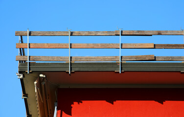 fall protection barrier with planks marks the work area on the roof
