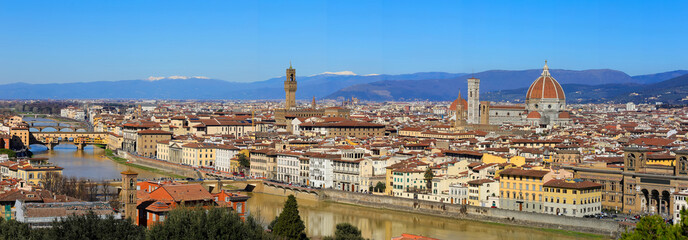 Wide view of Florence city with arno river and main monuments from Old Bridge  to town hall palace and dome of duomo with vivid vibrant colors