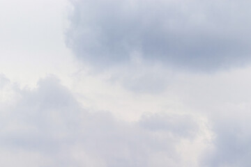 The lightly overcast sky is covered with clouds.