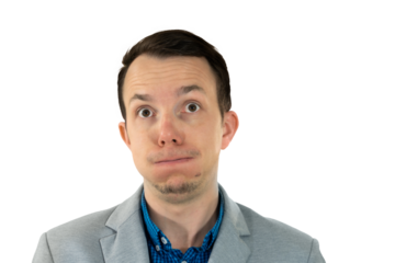 Man puffing cheeks and rolling eyes, humorous expression of frustration or exhaustion, gray suit and blue shirt studio close-up. isolated png