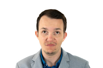 Man looking up with skeptical expression, dressed in formal-casual suit, studio isolated portrait, emotion of doubt or annoyance