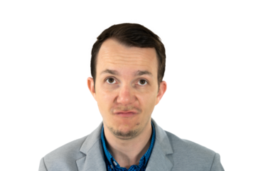 Man looking up with skeptical expression, dressed in formal-casual suit, studio isolated portrait, emotion of doubt or annoyance