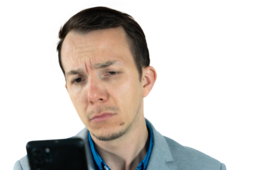 Man frowning while checking smartphone, expression of confusion or concern, studio isolated business-casual portrait