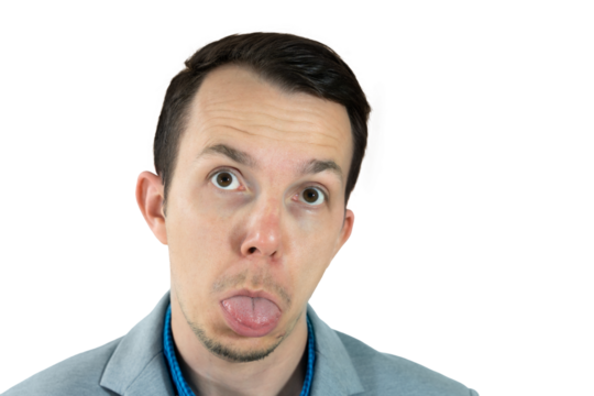 Silly face expression with tongue out, man in gray suit looking up humorously, isolated png studio portrait