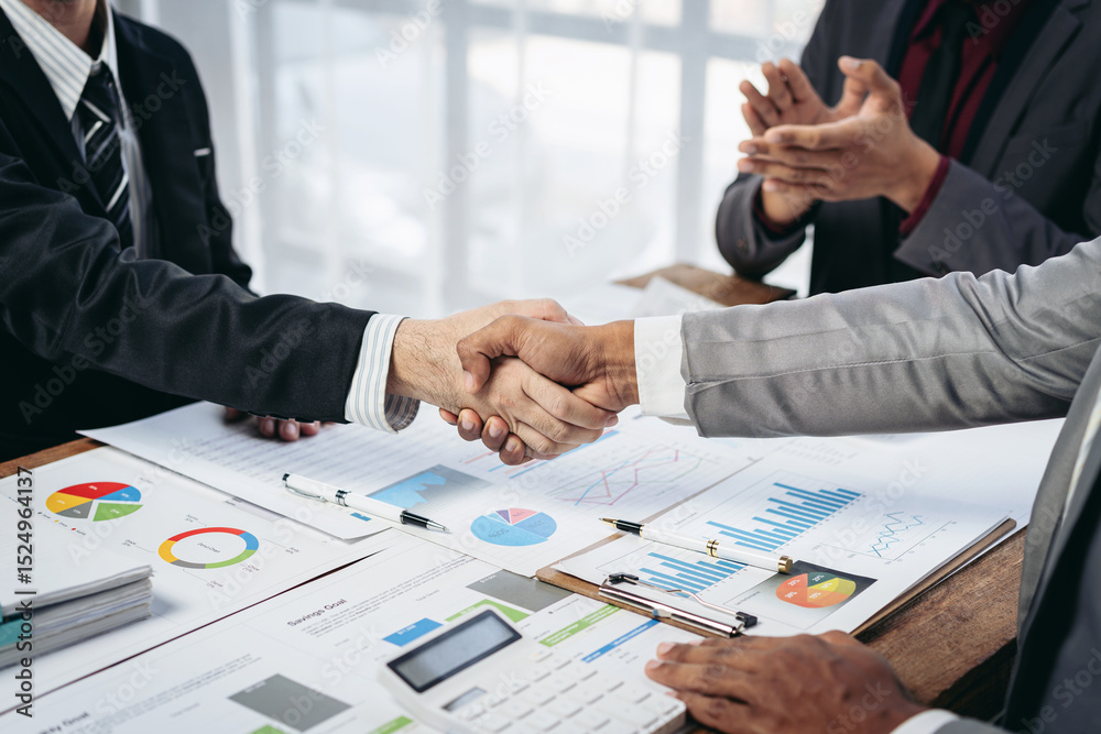 Poster a man shakes hands with another man in a business setting
