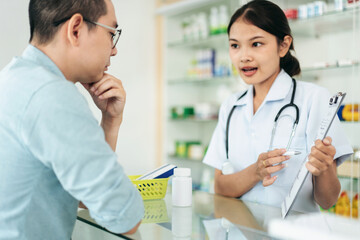 A woman is talking to a man in a pharmacy