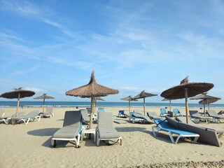 Beach in the netherlands. Empty beach with blue sky. sand, sea, chaise longue. Corner of Holland....