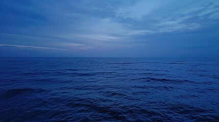 Fototapeta premium Vast Blue Ocean at Flat Camera Angle: Minimalist Coastal Serenity, Horizon-Defining Smooth Waters, and Endless Azure Depths in Soothing Maritime Photography