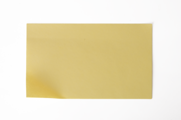 The Photo of a yellow notepaper on a white background, taken with a 45Mp high resolution camera.