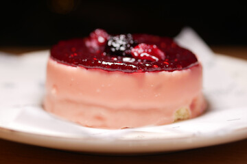 Delicious dessert with berry topping on a plate