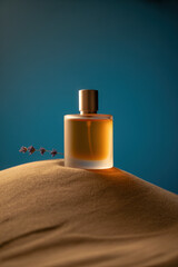 Elegant Perfume Bottle Surrounded by Soft Sand Dunes and Lavender Under Calm Blue Lighting