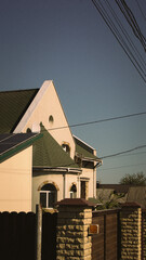 Residential building with solar panels under clear sky
