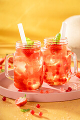 Sweet strawberry bubble tea with berry fruits, balls on ice.