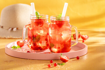 Cold strawberry bubble tea with berry fruits, balls on ice.