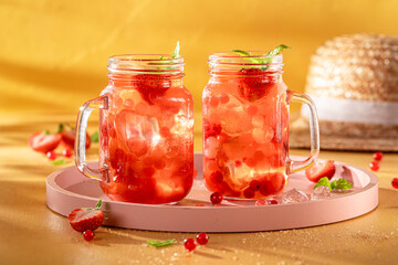 Refreshing strawberry bubble tea with berry fruits, balls on ice.