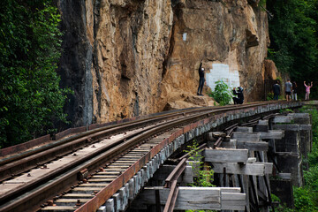 Train railway track between hellfire pass mountain and Si Sawat or Khwae Kwai river with forest...