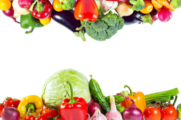 Border of fresh shiny colorful vegetables top and bottom.