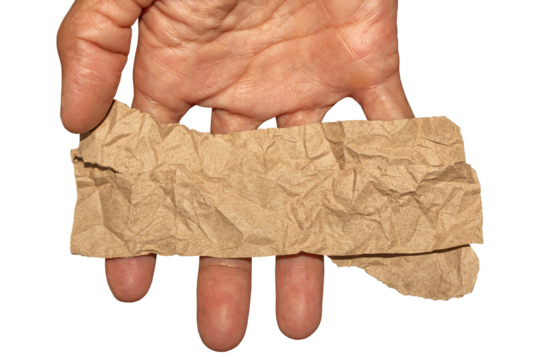 Man Hand Holding Torn Brown Crumpled Paper Texture Pieces on Transparent Background. Ideal for Text Space or Creative Project.