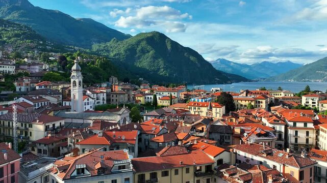 Drone establishing shot of Menaggio village on lake Como in Lombardy, Italy, luxurious holiday destination in Italy, Italian alpine lakes, resort on Como lake