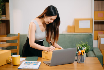 Small business entrepreneur SME freelance woman working at home office, BOX,tablet