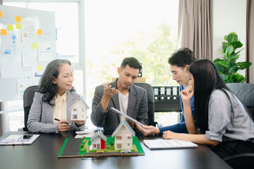 Fototapeta premium Asian Customers who choose to buy a condominium room and a bank approve a loan for their purchase.