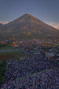Thousands gather for Eid al-Adha prayer at Garung Field with Mount Sindoro as backdrop, Wonosobo, Central Java, June 6, 2025