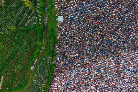 Top view of Thousands gather for Eid al-Adha prayer at Garung Field, Wonosobo, Central Java, June 6, 2025