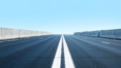Fototapeta premium Fresh asphalt highway under blue sky
