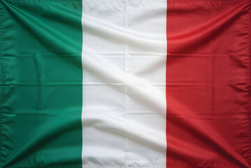 A vibrant italian flag, draped in soft folds, displays its rich green, white, and red colors