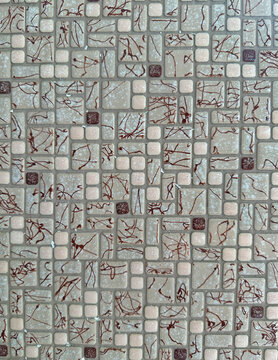 Vintage mosaic glazed floor tiles in blue, black and white