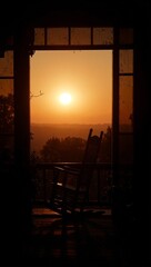 Rocking chair silhouette at sunset