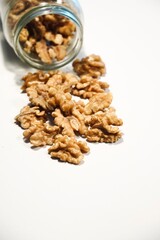 Organic Peeled Walnuts on White Table.