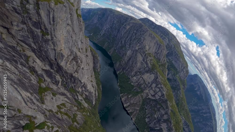Aufkleber breathtaking aerial view of a deep canyon surrounded by steep cliffs and a serene river in norway