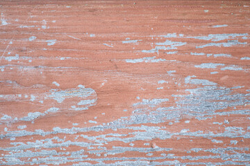 Old painted wood with crumbling paint. Wooden background.