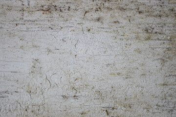 Old painted wood with crumbling paint. Wooden background.