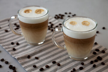 Homemade Latte Macchiato in Glasses, side view.