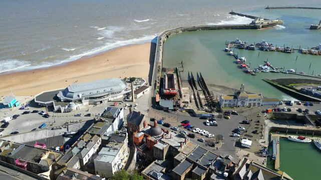 Aerial View of British Town on edge of Beach and Ocean.