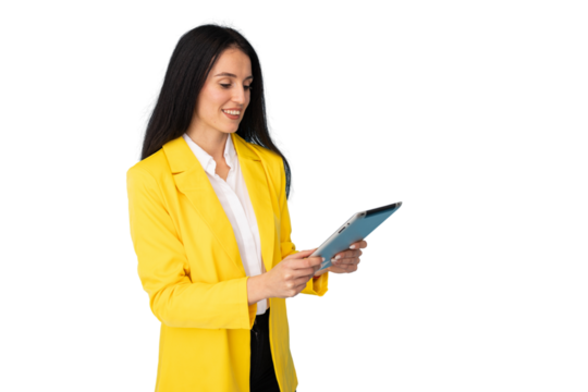 Professional businesswoman working on digital tablet, wearing yellow jacket and crisp white shirt
