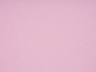 A serene pink paper texture offering a canvas of tranquility and subtle grace