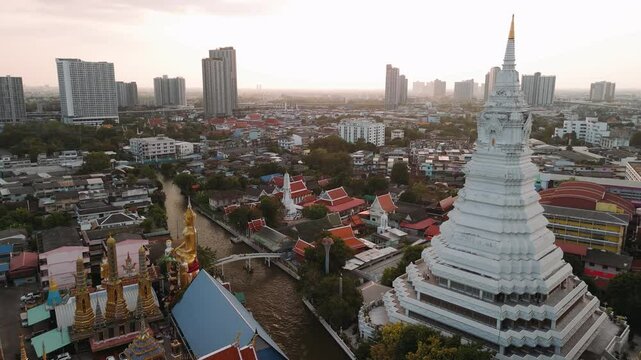 Aerial view of wat paknam phasi charoen temple and surrounding urban area in Bangkok, Thailand.