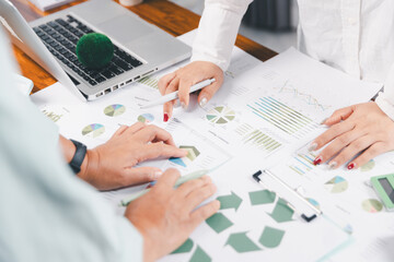 Business people working on sustainable innovation project. renewable energy concept. Teamwork Meeting, partner on model building company office technology, based green businesses and global warming.