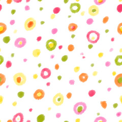 Multicolored dots. Seamless pattern of dots in yellow, orange, pink and green on a white background.