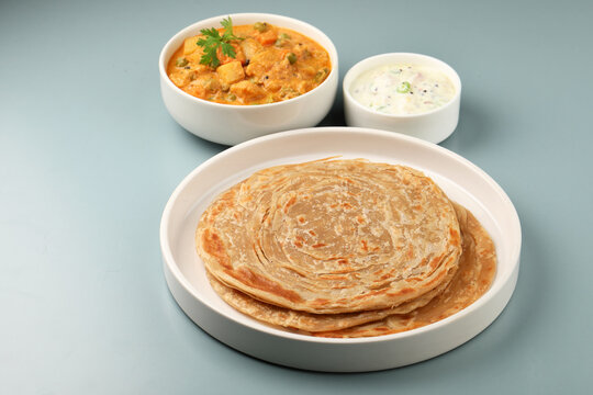 Parotta Kurma with Raita. South Indian famous dish