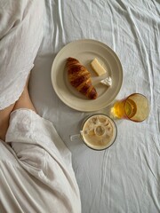 Cozy Breakfast in Bed with Coffee, Juice, and Croissant – Relaxed Morning