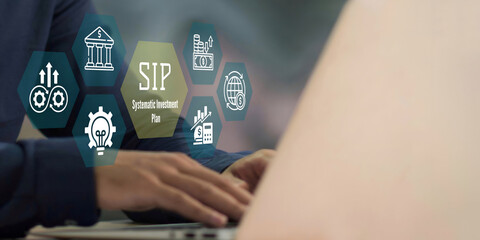 A business person using laptop with SIP Systematic Investment Plan concept.