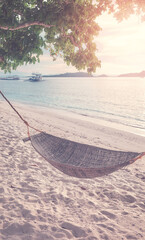 Hammock on the beach of a tropical island, color toning applied, Philippines.