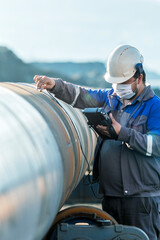 Technician are testing to welds of pipe with ultrasonic test method. It is a family of non-destructive testing techniques based on the propagation of ultrasonic waves in the object or material tested.