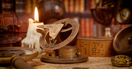 Vintage style travel and adventure. Vintage old compass and other vintage items on the table.